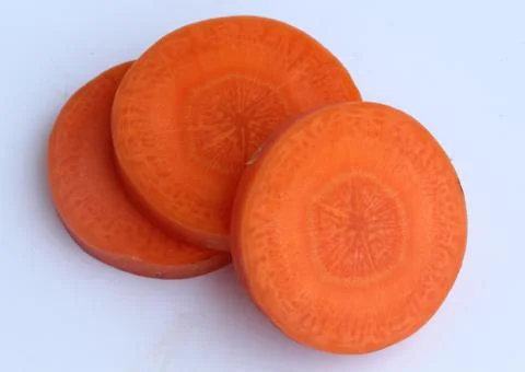 Carrot slice on white background Stock Photos