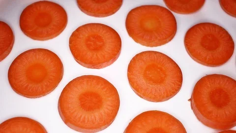 Carrot slices rotating seamless looping food texture pattern close up footage Stock Footage 103084736