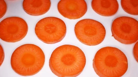 Carrot slices rotating seamless looping food texture pattern close up footage Stock Footage 103094652