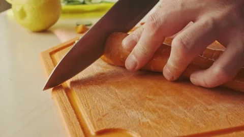Carrot slicing with a knife. Stock Footage 136651317