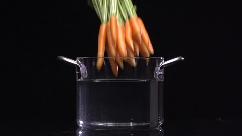 Carrot in the water black background Stock Footage 101528502
