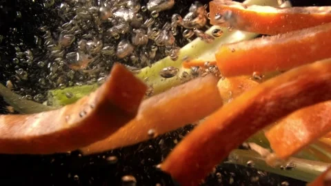 Carrots and celery fall into the water Video stock 233918712