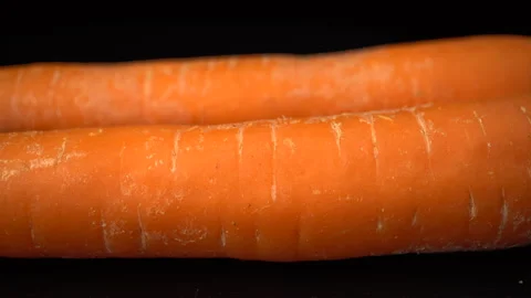 Carrots on a black background close-up. 스톡 동영상 147678262