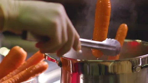 Carrots in boiling water Stock Footage 119300297