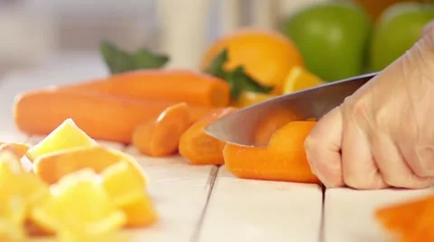 Carrots cut in slow motion Stock Footage 54558343