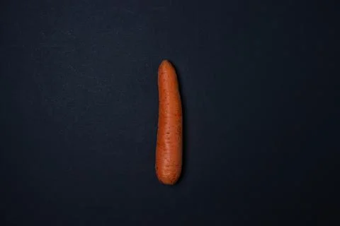 Carrots on a dark background Stock Photos