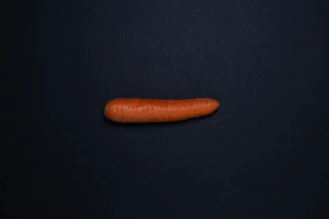 Carrots on a dark background Stock Photos