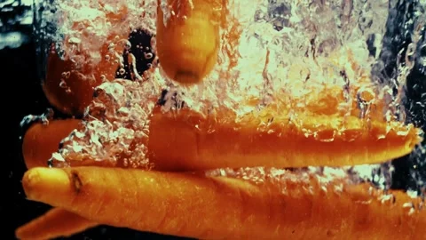 Carrots Drop in Water Stock Footage 300892771