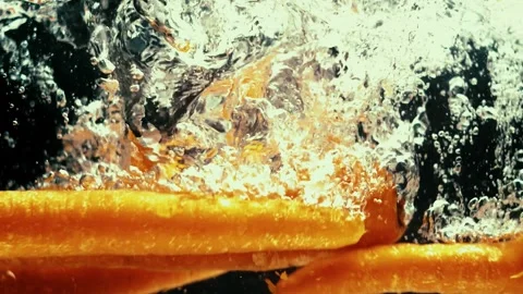 Carrots Fall Into Water Stock Footage 300890200