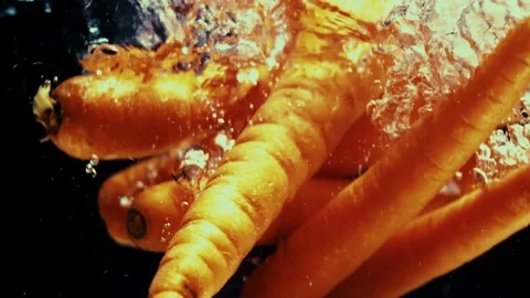 Carrots Fall into Water Stock Footage 300890403