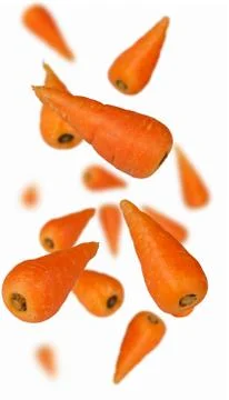 Carrots falling with blur Foto stock