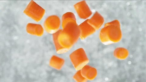 Carrots Falling into Pot of Boiling Water Stock Footage 271398922