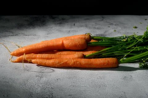 Carrots on a rustic table Stock Photos