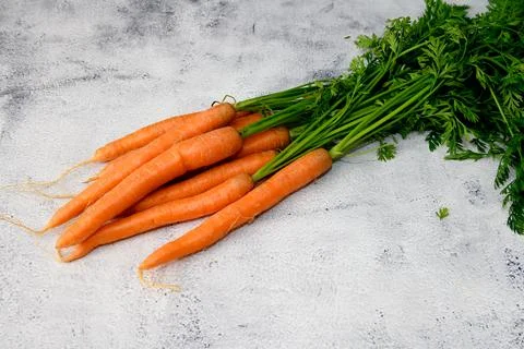 Carrots on a rustic table Stock Photos