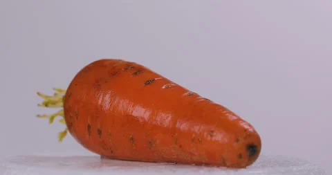 Carrots spinning on a white background. Stock Footage 130598171