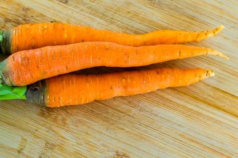 Carrots a stack of long and orange root, delicious and fresh vegetable Stock Photos