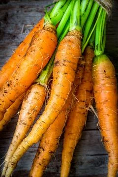 Carrots on the wooden table Stock Photos
