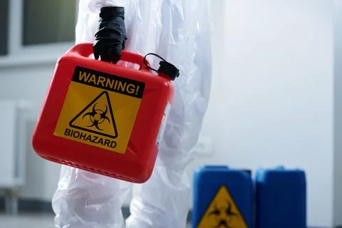 Carrying container with biohazard Stock Photos