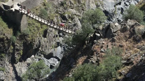 Carrying in Palanquin through Hanging Bridge over Indian river Ravi  Stock Footage 167750908