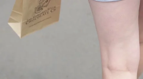 Carrying a small paper bag Stock Footage 59771842
