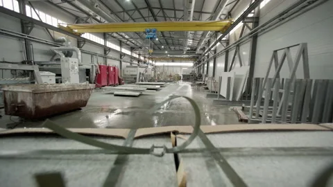 Carrying a stack of stone blocks using a trolley inside of a production factory 動画素材 205326211