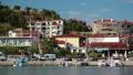 Cars and boats in harbour in Nea Skioni village in Greece HD Footage