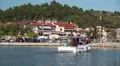 Cars and boats in harbour in Nea Skioni village in Greece HD Footage