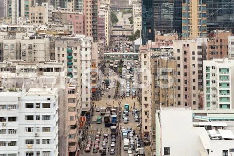 Cars and people with intersection streets in Sham Shui Po district. Architect Stock Photos