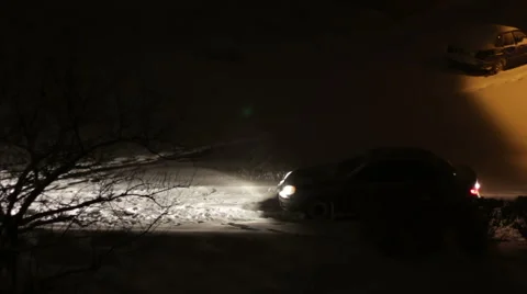 Cars are going in the Night in Winter on Snow-Covered Roads Stock Footage 59303149