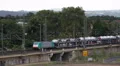 Cars Automobiles Vehicles Cargo Train Passing Aerial View Shipping Transport Day HD Footage