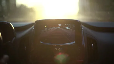 A car's backup camera in action at sunset. Close up Stock Footage 64778577
