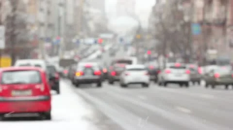 Cars in the city in the winter of.Blurred scene with the snow Stock Footage