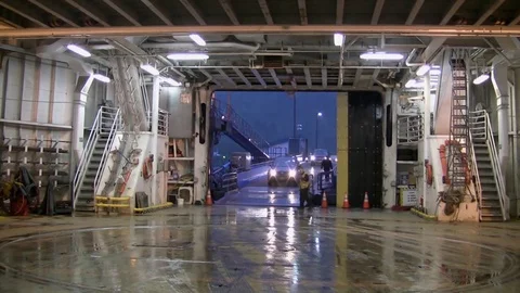 Cars come down entry ramp and onto Alaskan ferry. Stock Footage