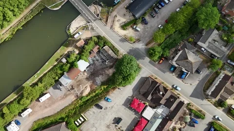 Cars crossing the Patch swingbridge, Gloucester and Sharpness Canal, UK Stock Footage 313481004