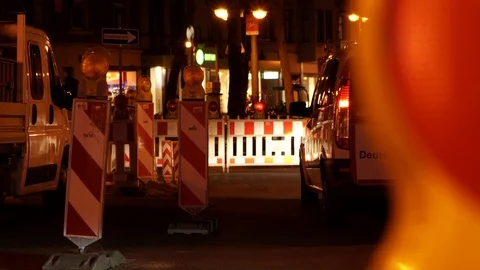 Cars deviating due to traffic beacon signs blocking a street at night 스톡 동영상 118208763