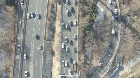Cars drive along loop shaped road junction top view. Stock Footage 169913367