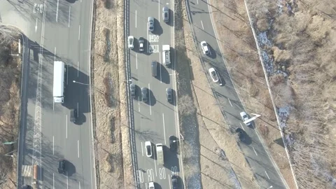 Cars drive along loop shaped road junction top view. Stock Footage 170872362