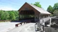 Cars Drive Over The Quechee Covered Bridge In Vermont 4k or 4k+ Resolution