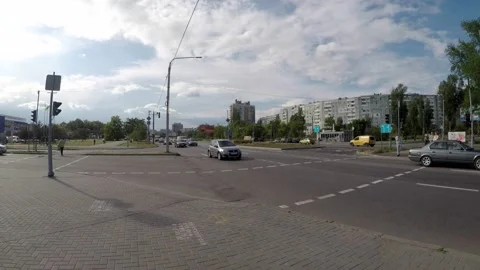 Cars drive through the intersection with traffic lights Stock Footage 131094466