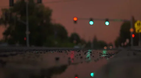 Cars Drive through Wet Intersection Stock Footage 40344109