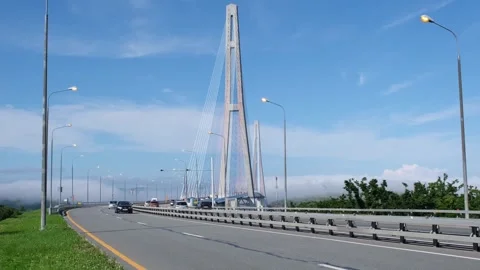 Cars drivind along the Cable-stayed Russky Bridge in Vladivostok, Russia Stock Footage 243357748