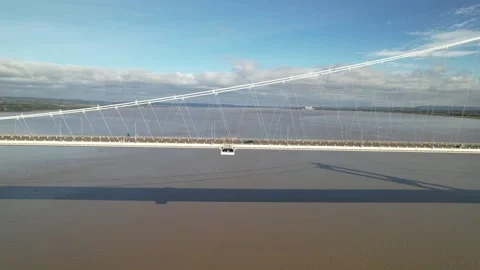 Cars driving on cable-stayed bridge, modern transport structure above water Stock Footage 166697121