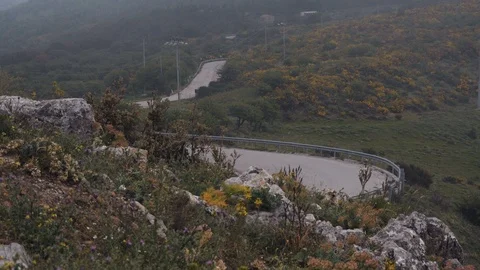 Cars driving down a hill Stock Footage 88722992