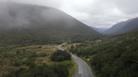 Cars Driving On Misty Highway in the Clouds | New Zealand Alps Stock Footage