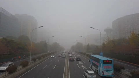 Cars driving on North 2nd Ring Road on smoggy day. Stock Footage