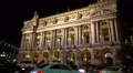 Cars driving past illuminated Academie Royale de Musique in Paris, traffic jam 4k or 4k+ Resolution