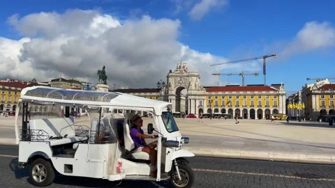 Cars driving by the Praca do Comercio in Lisbon Stock Footage 220090065