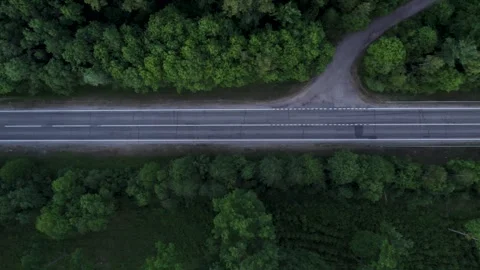 Cars driving on the road between the fields	 in sunset Stockbeeldmateriaal 243512119