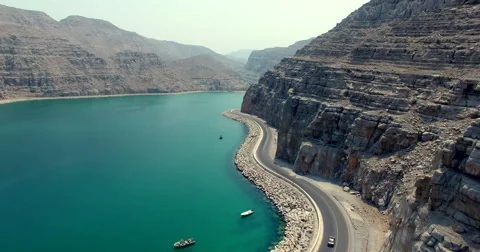 Cars driving on road Musandam Sultanate of Oman Stock Footage 68584372