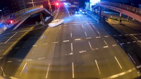 Cars driving through an intersection Stock Footage 240679592